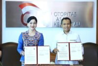 Otoritas Jasa Keuangan (OJK) dan Bareskrim Polri menandatangani Perjanjian Kerja Sama (PKS) untuk memperkuat koordinasi penanganan tindak pidana di sektor jasa keuangan. Foto: Istimewa